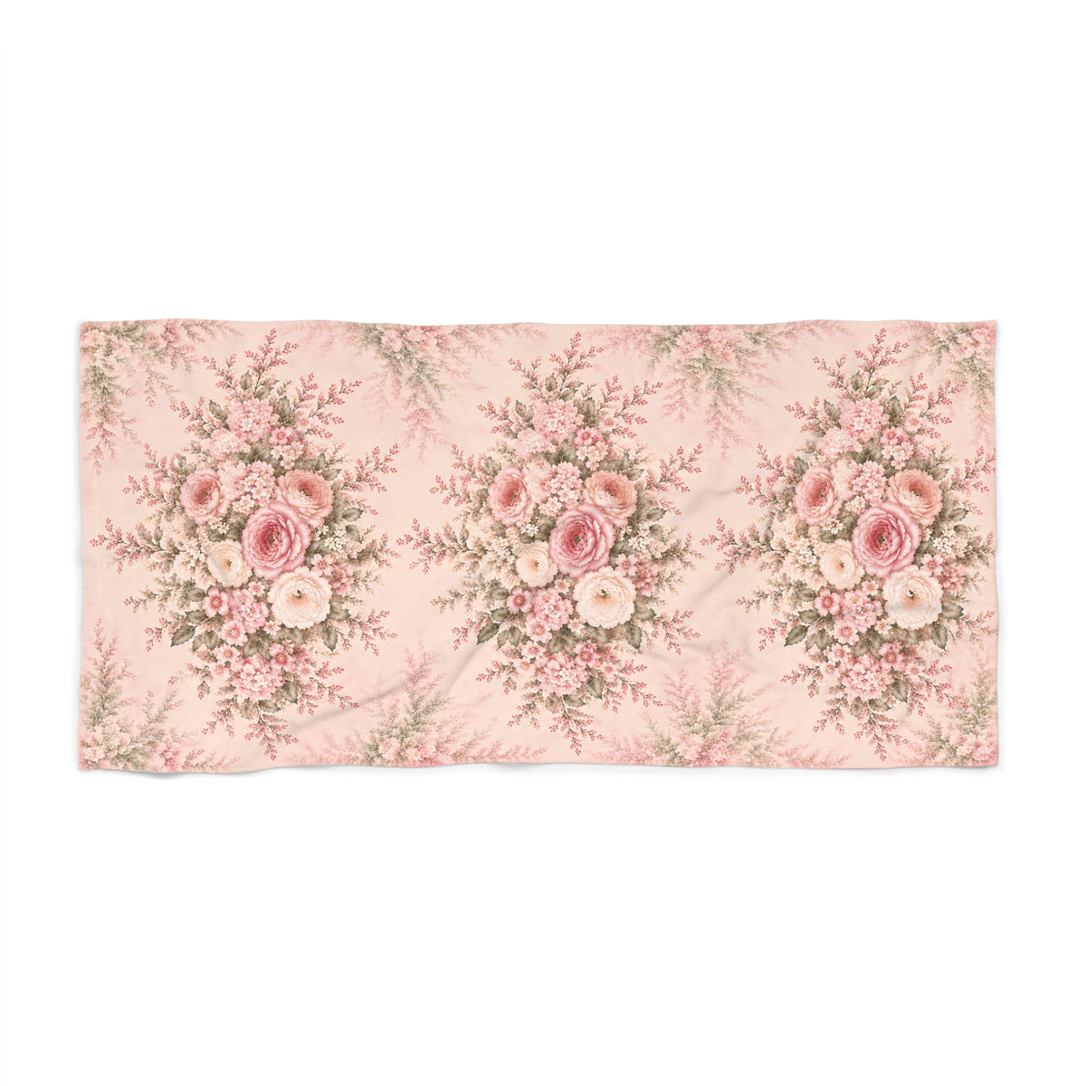 A rectangular large bath towel featuring a repeating vintage floral bouquet pattern in shades of pink, cream, and muted green on a pale pink background.