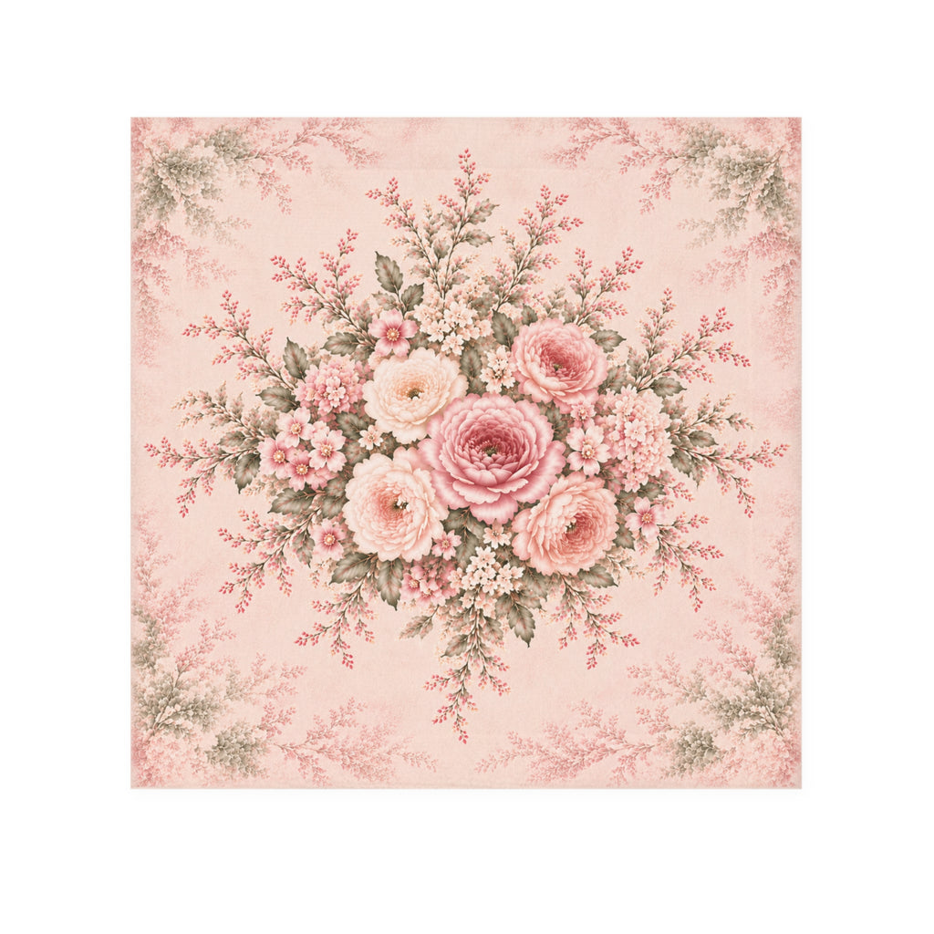 A square decorative washcloth featuring a vintage floral bouquet in soft pink, blush, cream, and muted green on a pale pink background with a subtle border pattern.