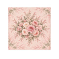 A square decorative washcloth featuring a vintage floral bouquet in soft pink, blush, cream, and muted green on a pale pink background with a subtle border pattern.